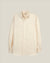 A light cream-colored long-sleeve button-down shirt with a single chest pocket, displayed on a neutral light gray background.  Made in USA Oxford Cloth Button Down shirt.