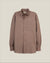 A long-sleeve button-down shirt in a muted taupe-brown color, featuring a chest pocket and a classic collar, shown against a solid light beige background.  Made in USA Oxford Shirt.